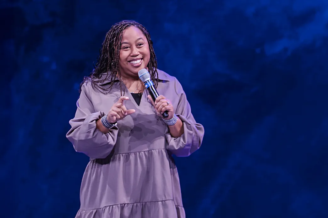 Chrystal Evans Hurst holding a microphone