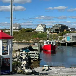 Small harbor with a red boat sitting at the dock